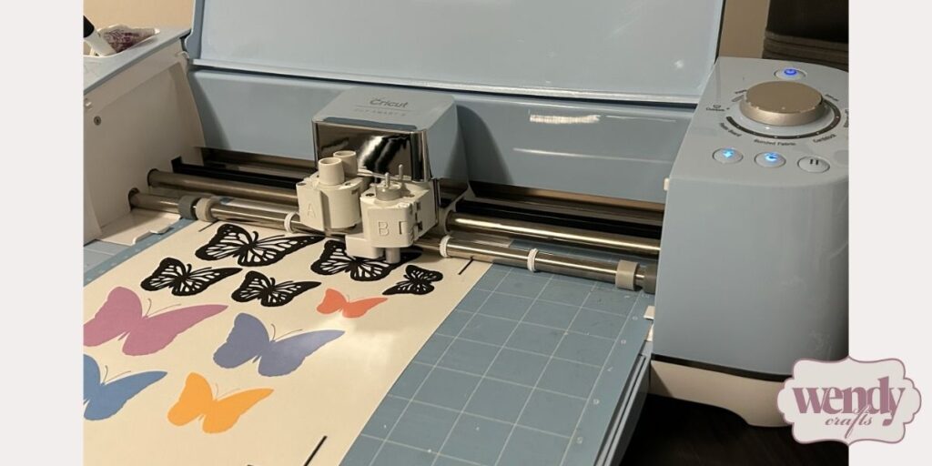 Circuit machine cutting butterfly designs.