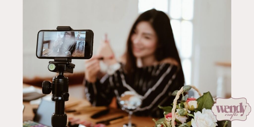 A crafter is recording for sharing online with others.
