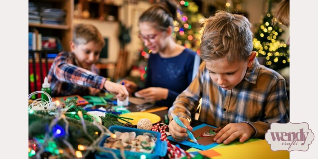 Three kids creating holiday crafts together.